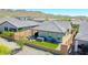 Overhead backyard shot, featuring a hot tub, fire pit, artificial grass, and a cozy patio area at 16528 W Pedro Ln, Goodyear, AZ 85338