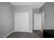 Bright bedroom with sliding closet doors and neutral walls, offering a calm, inviting space at 16528 W Pedro Ln, Goodyear, AZ 85338