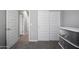 A bright bedroom with sliding closet doors and neutral walls, offering a calm, inviting space at 16528 W Pedro Ln, Goodyear, AZ 85338