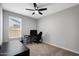 Bright bedroom features neutral paint and a ceiling fan for comfortable living at 16528 W Pedro Ln, Goodyear, AZ 85338
