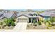 Charming single-story home featuring a well-manicured front yard and an attached two-car garage at 16528 W Pedro Ln, Goodyear, AZ 85338