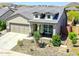 Charming single-story home with a two-car garage and stone accents enhancing the curb appeal at 16528 W Pedro Ln, Goodyear, AZ 85338