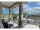 Cozy front porch featuring stone pillars and comfortable seating creating an inviting outdoor space at 16528 W Pedro Ln, Goodyear, AZ 85338