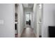 Bright hallway includes laundry facilities with tile floors and easy access to other rooms at 16528 W Pedro Ln, Goodyear, AZ 85338
