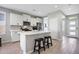Bright kitchen featuring white cabinetry, a center island, and stainless steel appliances, perfect for cooking at 16528 W Pedro Ln, Goodyear, AZ 85338