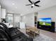 Spacious living room combines comfort with modern technology for an optimal entertainment experience at 16528 W Pedro Ln, Goodyear, AZ 85338