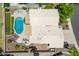 Birds eye view of the backyard pool, bbq area, and the roof of the home at 18854 N 73Rd Dr, Glendale, AZ 85308