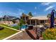 Beautiful backyard oasis featuring a pool, patio, and lush landscaping at 18854 N 73Rd Dr, Glendale, AZ 85308