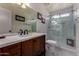 Renovated bathroom features marble floors, dark wood vanity, and a glass shower at 18854 N 73Rd Dr, Glendale, AZ 85308
