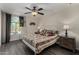 Cozy bedroom featuring a decorative ceiling fan, a window, and stylish furnishings at 18854 N 73Rd Dr, Glendale, AZ 85308