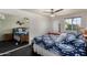 Bedroom with a window and a large mirror at 18854 N 73Rd Dr, Glendale, AZ 85308