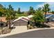 Charming home with a three-car garage and mature landscaping at 18854 N 73Rd Dr, Glendale, AZ 85308