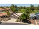 Charming home with a three-car garage, mature landscaping, and golf course view at 18854 N 73Rd Dr, Glendale, AZ 85308