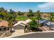 Beautiful view of the home with a well-manicured yard and mature palm trees at 18854 N 73Rd Dr, Glendale, AZ 85308