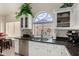Features a large decorative window above the sink, providing natural light and a unique touch at 18854 N 73Rd Dr, Glendale, AZ 85308