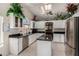 Bright kitchen with stainless steel appliances, ample counter space, and an island for food preparation at 18854 N 73Rd Dr, Glendale, AZ 85308