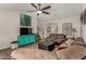 Open living room showcasing neutral decor, hardwood floors, and a staircase at 18854 N 73Rd Dr, Glendale, AZ 85308