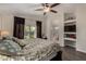 Serene main bedroom with private patio access and an en-suite bathroom entrance at 18854 N 73Rd Dr, Glendale, AZ 85308