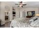 Comfortable main bedroom with an en-suite bathroom with vanity and mirror at 18854 N 73Rd Dr, Glendale, AZ 85308