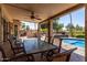 Covered patio with ceiling fan provides a relaxing outdoor space for dining and entertaining at 18854 N 73Rd Dr, Glendale, AZ 85308
