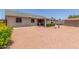 Spacious backyard featuring a covered patio area, storage shed, and low-maintenance landscaping at 1925 W 12Th Ave, Apache Junction, AZ 85120