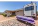 View of backyard featuring covered patio, RV parking, and desert landscape at 1925 W 12Th Ave, Apache Junction, AZ 85120