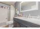 Bathroom featuring a modern vanity with marble countertop and a shower-tub combo at 1925 W 12Th Ave, Apache Junction, AZ 85120