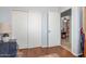 Bedroom featuring sliding closet doors and a doorway to another room at 1925 W 12Th Ave, Apache Junction, AZ 85120