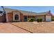 Well-maintained single Gathering home featuring gravel landscaping and an RV parking area at 1925 W 12Th Ave, Apache Junction, AZ 85120