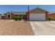 Charming single Gathering home featuring manicured landscaping and a two-car garage at 1925 W 12Th Ave, Apache Junction, AZ 85120