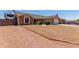 Well-maintained single Gathering home featuring gravel landscaping and an RV parking area at 1925 W 12Th Ave, Apache Junction, AZ 85120