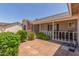 Enclosed front patio is the perfect spot to relax and enjoy the beautiful neighborhood at 1925 W 12Th Ave, Apache Junction, AZ 85120