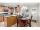 Cozy kitchen with wood cabinetry, granite countertops, a microwave, and a view of the outside at 1925 W 12Th Ave, Apache Junction, AZ 85120