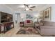 Inviting living room featuring neutral tones, comfortable seating, ceiling fan and decorative artwork at 1925 W 12Th Ave, Apache Junction, AZ 85120