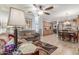 Spacious living room flows into the dining area with a ceiling fan and views of the kitchen at 1925 W 12Th Ave, Apache Junction, AZ 85120