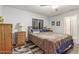 Serene main bedroom with a ceiling fan, soft lighting, and comfortable bedding at 1925 W 12Th Ave, Apache Junction, AZ 85120