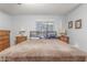 Relaxing main bedroom with a window, lamps and decor and neutral wall color at 1925 W 12Th Ave, Apache Junction, AZ 85120