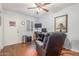 This bright office has a ceiling fan, dark wood floors, and a work space at 1925 W 12Th Ave, Apache Junction, AZ 85120