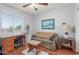 Charming office area with wood floors, and a cozy sofa next to a window at 1925 W 12Th Ave, Apache Junction, AZ 85120