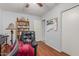 This spacious office with wood flooring features a comfortable black recliner at 1925 W 12Th Ave, Apache Junction, AZ 85120