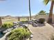 Landscaped backyard showcasing a scenic view of the adjacent golf course and distant mountains at 2053 E Clubhouse Dr, Phoenix, AZ 85048