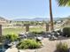 Scenic backyard view showcasing the manicured golf course and impressive mountain range in the distance at 2053 E Clubhouse Dr, Phoenix, AZ 85048