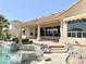 Relaxing backyard featuring a sparkling pool, expansive patio, and lush landscaping, creating a private oasis for entertaining at 2053 E Clubhouse Dr, Phoenix, AZ 85048