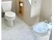 Full bathroom including toilet, bidet, and built in toilet paper storage at 2053 E Clubhouse Dr, Phoenix, AZ 85048