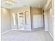Spacious carpeted primary bedroom with neutral tones, recessed lighting, and ensuite bathroom at 2053 E Clubhouse Dr, Phoenix, AZ 85048