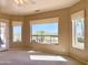 Comfortable bedroom featuring plush carpeting, multiple windows and door to the outside covered patio at 2053 E Clubhouse Dr, Phoenix, AZ 85048