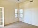 Neutral bedroom featuring carpet, ceiling fan, and natural light from two windows at 2053 E Clubhouse Dr, Phoenix, AZ 85048