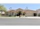 Charming single-story home featuring a well-manicured lawn, desert landscaping and a terracotta tile roof at 2053 E Clubhouse Dr, Phoenix, AZ 85048