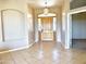 Foyer showcasing a decorative light fixture and the beautiful wood entry door at 2053 E Clubhouse Dr, Phoenix, AZ 85048