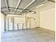 Two car garage featuring storage shelving and a neutral color scheme at 2053 E Clubhouse Dr, Phoenix, AZ 85048